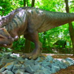 Ceratosaurus in the woods scaled